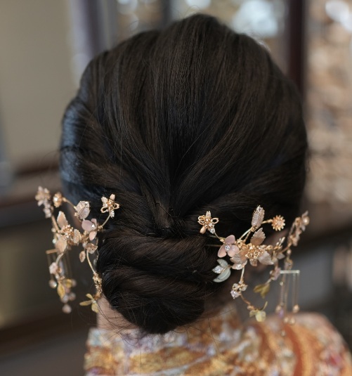 Evening hair styling with a gold detail